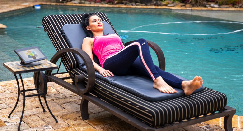 woman relaxing on PEMF mat